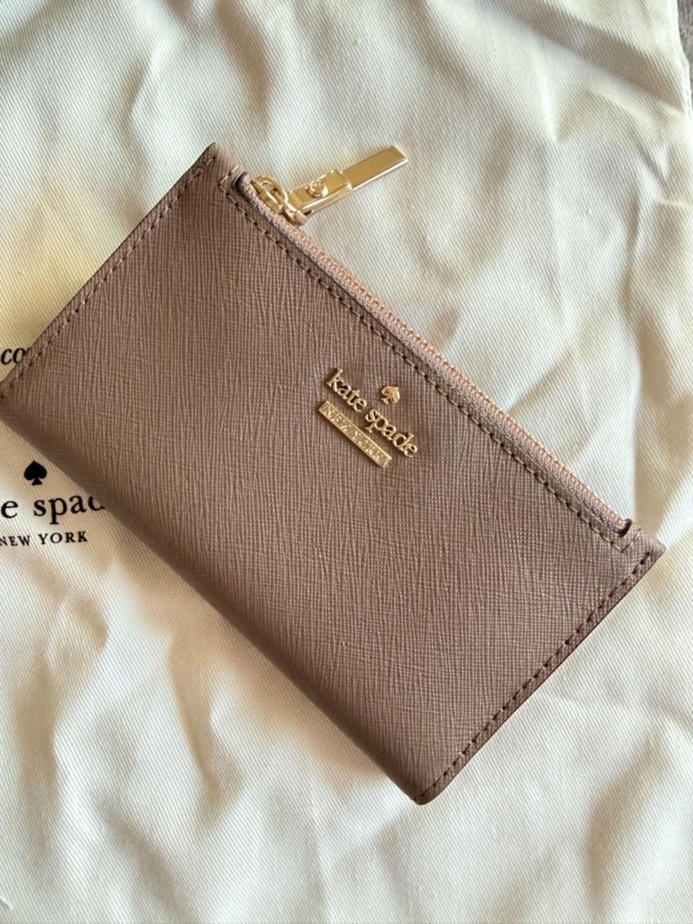 kate spade tan zip card case with gold logo